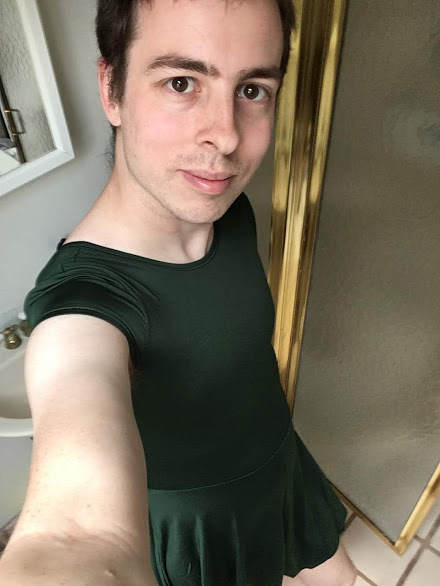 Selfie of man in tight-fitting green dress