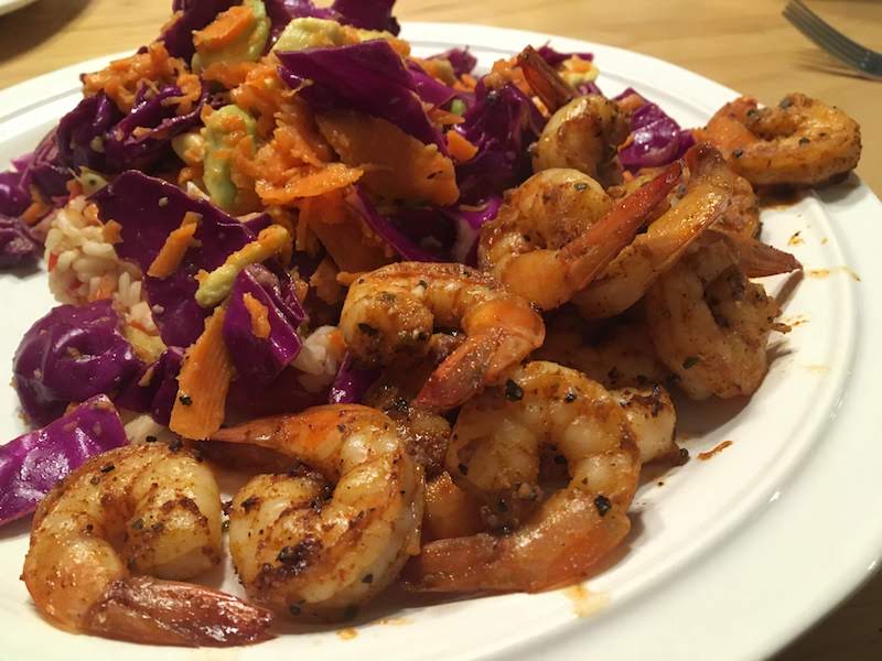 Mexican-spiced Shrimp with Roasted Tomato Rice and Slaw, pictured on a plate